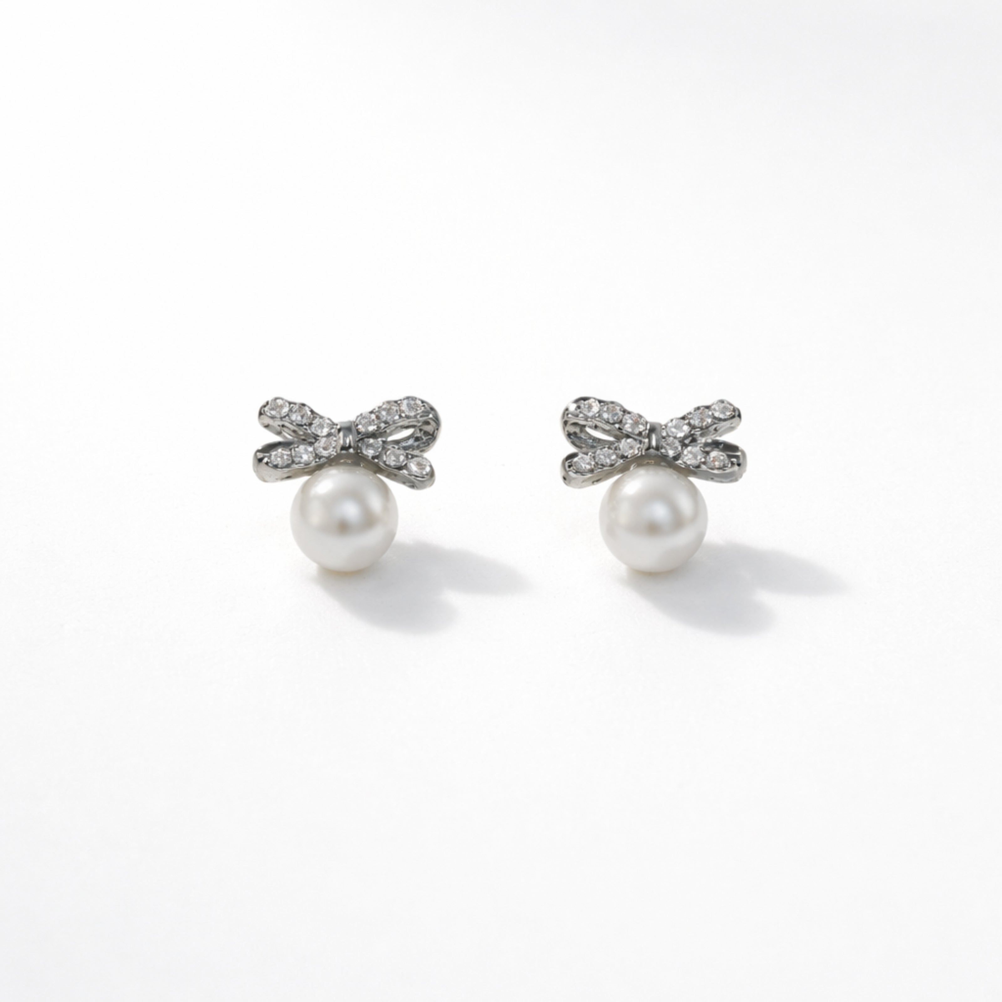 Pearl Bow Sparkle Stud