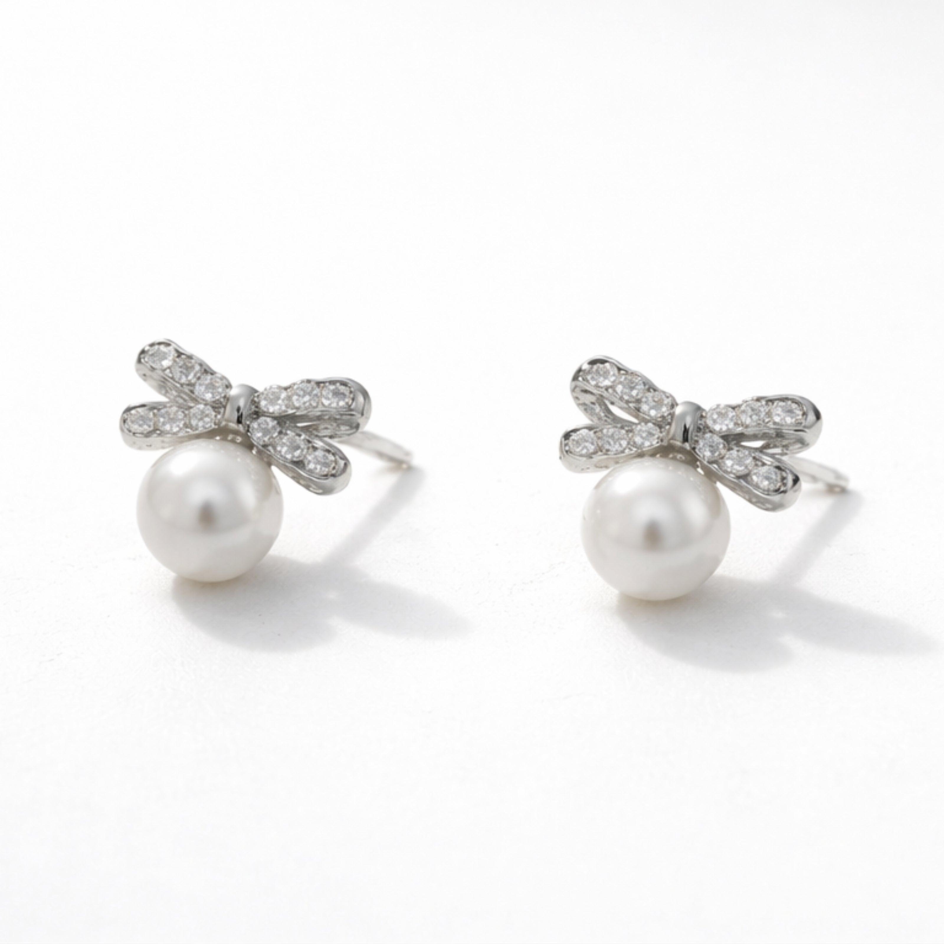 Pearl Bow Sparkle Stud