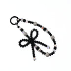 Onyx Bow Statement Charm